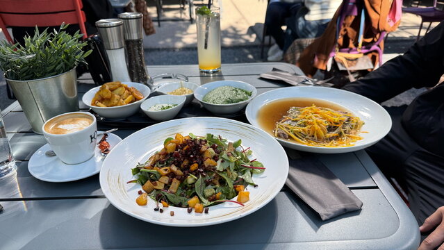 Traditional alpine lunch dishes served on terrace under sunlight for lifestyle marketing
