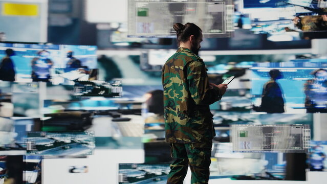 Army officer analyzes satellite data in a virtual war zone, using digital threat detection tools for national safety, mission control and military strategy.