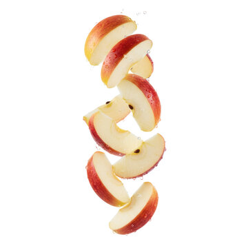 Hyperrealistic Gala apple wedges with crimson red skin and crisp white flesh, suspended in free fall against a transparent studio background with copy space, concept of premium freshness