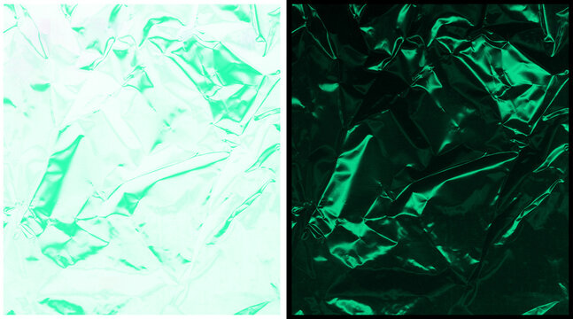 Emerald green crumpled foil texture, metallic wrinkled paper background, shiny creased plastic surface for luxury packaging and holiday design