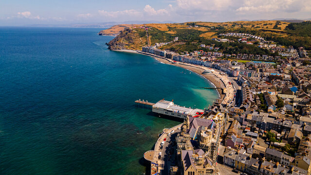 Aerial panorama of Aberystwyth seafront pier royal pier and constitution hill