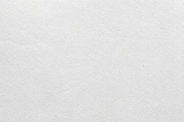 Fototapeta premium Pristine Paper Surface Background. A detailed view of white, fibrous material showcasing its natural grain. This immaculate, pure canvas symbolizes new beginnings and creative potential.