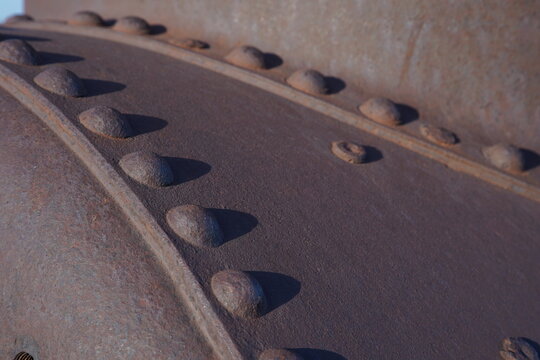 rusty metal rivet pattern