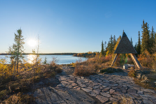 Frame Lake shore at sunset time, clear sky and sunlight. Yellowknife, Canada.
