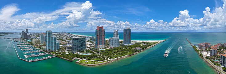 Fototapeta premium Miami South beach. Aerial skyscraper cityscape with marina panorama. Travel destination. Luxury skyscraper in Miami, Florida. Summer travel vacation. City panorama. Aerial panoramic marina