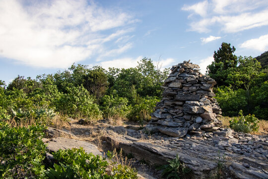 Stacked Rock Cairn Trail Marker on Hidden Valley Loop Trail via Taylor Canyon Above Ogden Utah in Summer with Wasatch Mountain Peaks Beyond