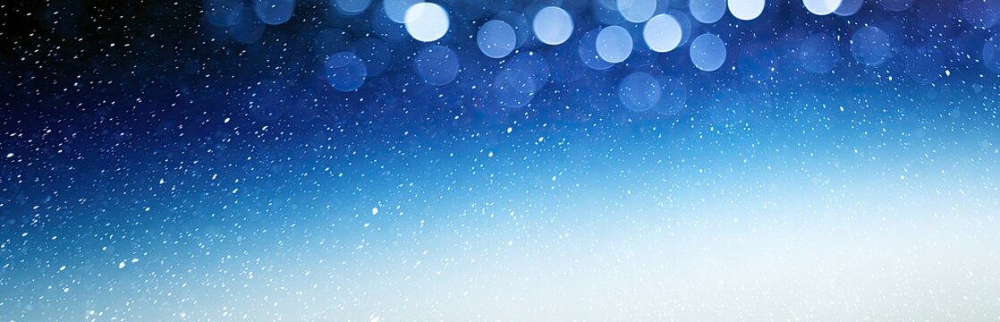 Soft blue bokeh lights and tiny white specks cascade across a gradient
