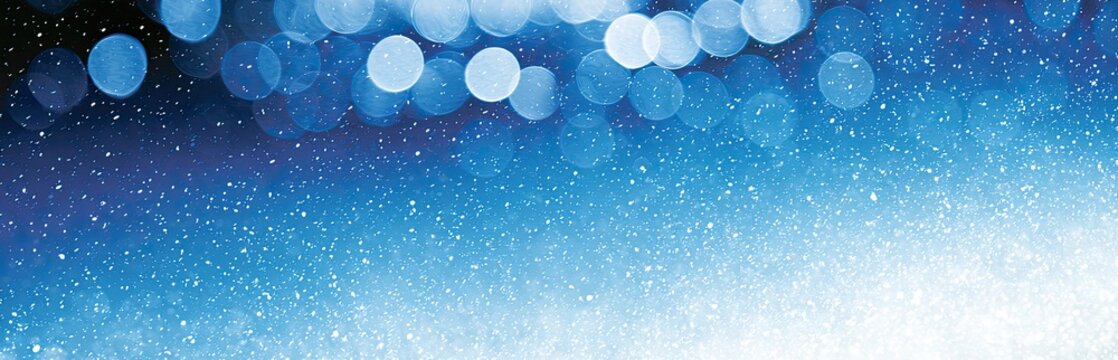 Soft blue bokeh lights and shimmering particles fade into white