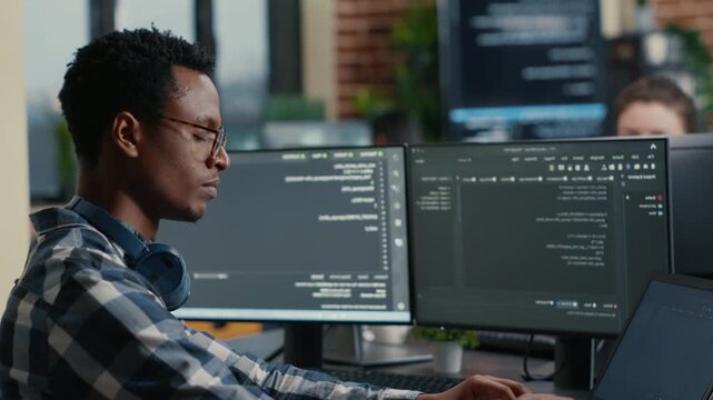 Database developer pauses during software work to consider code results, connecting programming decisions, laptop workflow and debugging logic