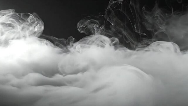 Abstract white smoke swirls rising against a dark background