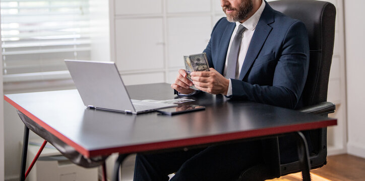 Businessman count money at office desk. Business man freelancer count dollar at office. Ambitious entrepreneur count money. Successful invest money in business. Business success