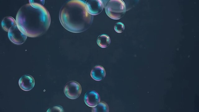 Colorful soap bubbles floating against a dark background