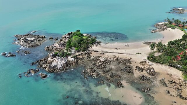 Magnificent Aerial View of Parai Tenggiri Beach Featuring Granite Islets, Turquoise Sea, White Sand Shoreline and Tropical Paradise Resort