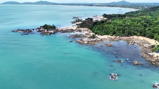 Stunning Aerial Panorama of Teluk Karang Beach Bangka Featuring Turquoise Waters, Granite Coastline, Tropical Forest and White Sandy Shores Paradise
