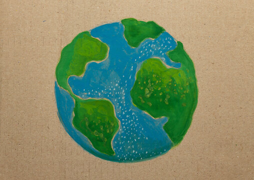 Earth Day painting activist artwork showing finished hand painted globe on cardboard