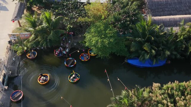Serene River Journey. Scenic Aerial Scene Of Family Cruising Calm Village Canal. Elevated Perspective Showcasing Family Enjoying Relaxing Boat Trip Through Peaceful Village Waterway