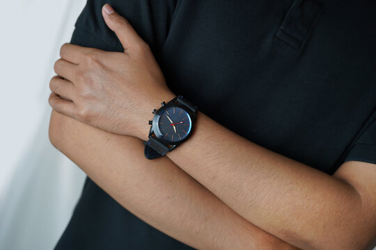 Young Asian Man Wearing Modern Black Wristwatch with Casual Outfit, Close Up Lifestyle Fashion Portrait