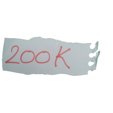 A torn white paper note with the number 200k written in red ink isolated on transparent background
