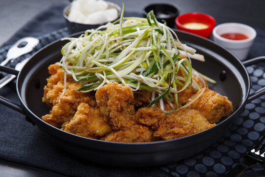 Korean fried chicken topped with shredded green onion padak
