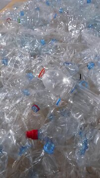 Used transparent plastic bottles prepared for recycling and sorting process