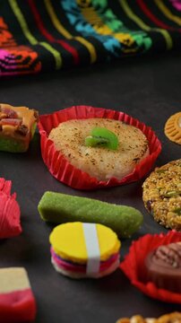 Mexican gastronomy. Traditional candies with a colorful textile handicraft in the background