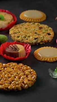 Traditional Mexican sweets, colorful desserts on the table. Palanqueta, cocada and tortita de Santa Clara