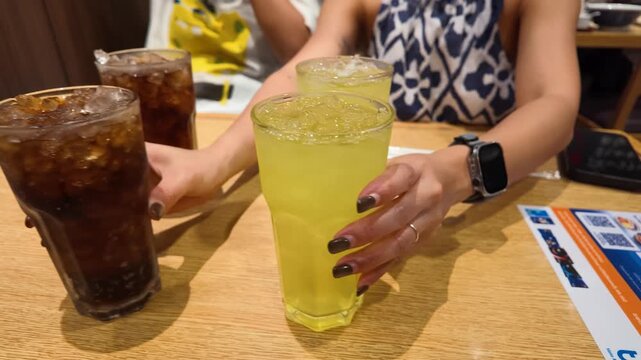 Close Up of Iced Tea and Soda Glasses on Restaurant Table