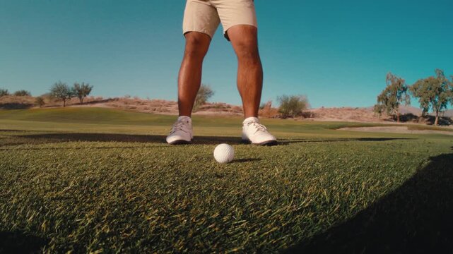 golfer hits ball and makes perfect divot in the fairway, scratch golfer close up wide angle push in extreme slow motion golf shot from the side with dirt flying on sunny day in 4k 800 fps