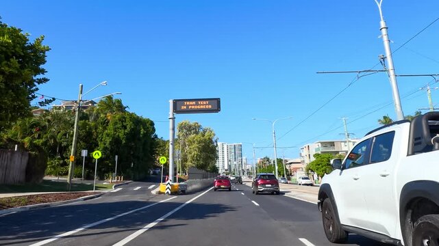 White Pickup Truck Driving on Sunny Gold Coast City Street
