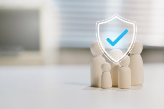 People protection concept. Wooden team with shield check mark represents verified safety and organizational security, trust, compliance, support, assurance