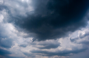 Obraz premium Dark sky with stormy clouds. Dramatic sky rain,Dark clouds before a thunder-storm,clouds before rain