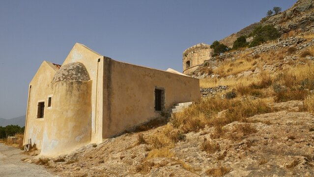 A historic building on a hillside with dry vegetation and mountains in the background, Venetian Sea Fortress, Leper Island, Spinalonga, Elounda Bay, Mirabello Bay, East Crete, Crete, Greek Islands, Greece