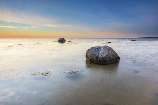 Large boulders on the beach of the Baltic Sea at sunset, Wismar Bay, Baltic Sea, Mecklenburg-Western Pomerania, Germany