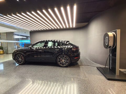 Bangkok, Thailand - May 31, 2026: Black Porsche Cayenne E Hybrid at Porsche showroom at Siam Paragon 
