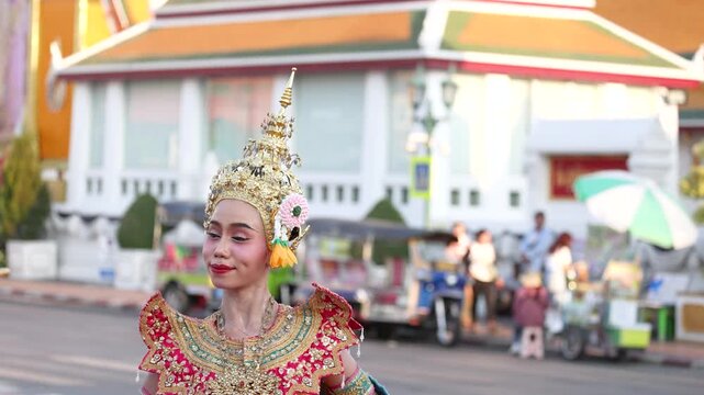 Traditional Thai Dancer in Ornate Costume Performing Near Bangkok Temple