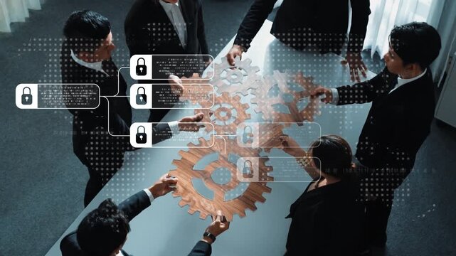 A diverse business team collaborates at a modern office table, engaging with gear puzzle and digital security symbols to create innovative strategies and solutions. Raster