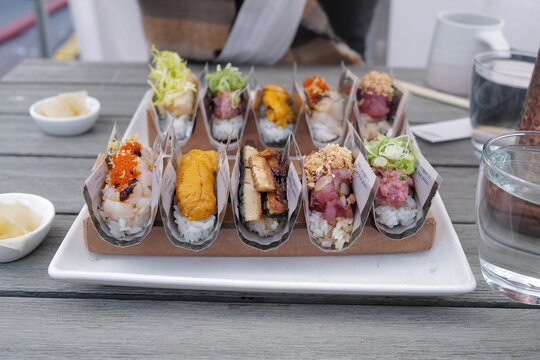 Close up assorted fresh and raw hand roll sushi- Japanese food