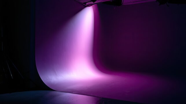 Professional purple cyclorama studio wall with bright spotlight
