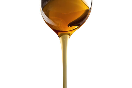 Golden honey or syrup stream pouring, sweet liquid food dripping, transparent background for cooking and baking concepts