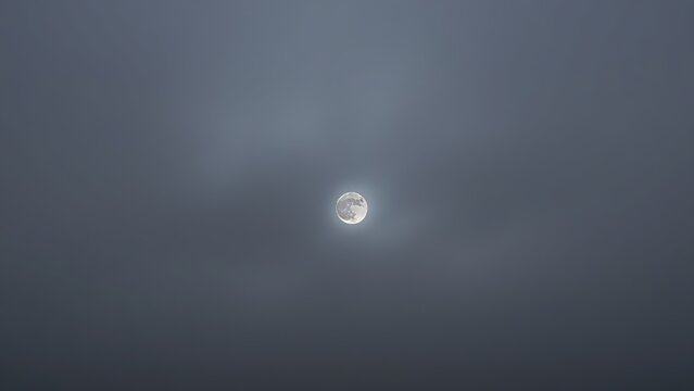 Heavy, overcast sky at dusk with thick gray clouds blocking the sun.