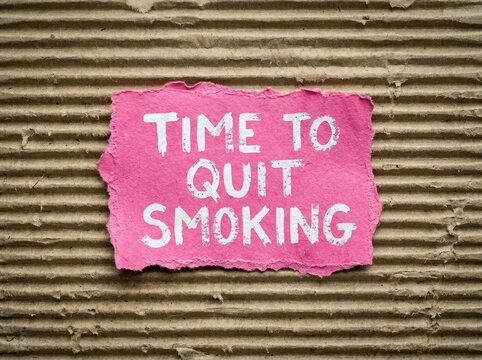 Time to quit smoking, a call to action on torn pink paper with white text, symbolizing health and a fresh start.