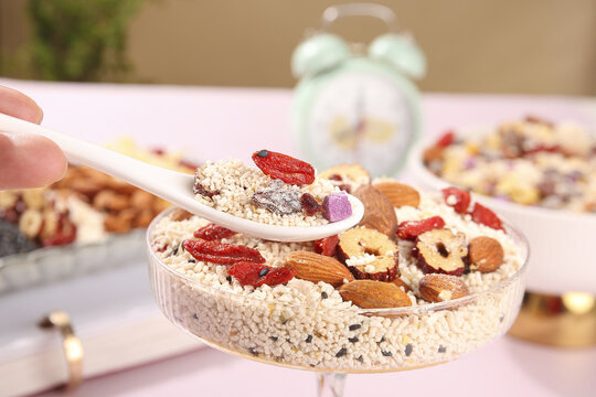 Healthy quinoa breakfast bowl with goji berries, nuts and dates superfood meal