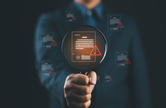 Error detection and document verification concept with magnifying glass highlighting warning alerts on digital files. Symbol of risk analysis, troubleshooting, compliance check and quality control.