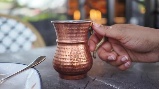 his forged copper mug is traditionally used for serving Ayran, a Turkish yogurt drink