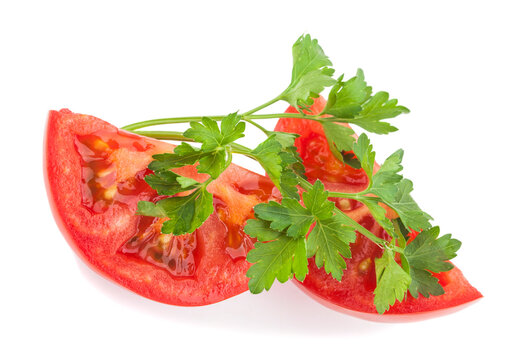 Tomatoes and parsley and cilantro isolated on a white background.