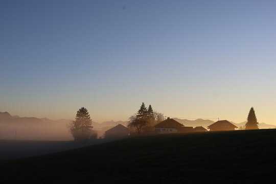 Misty Alpine Village at Sunrise