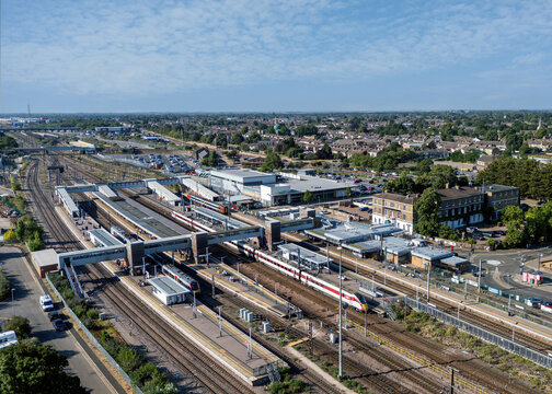 Peterborough Railway Station, Peterborough, Cambridgeshire, England, aerial view of the major East Coast Main Line railway station with platforms, trains and surrounding city centre.