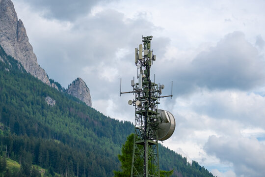 Telecommunication tower with mountain landscape in the Dolomites, Italy