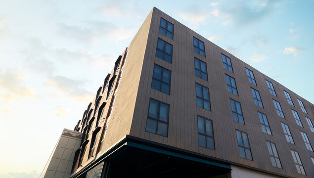 Modern building facade against blue sky in urban apartment complex