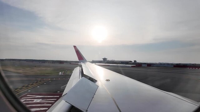 Aircraft Wing Reflection During Runway Taxi Movement